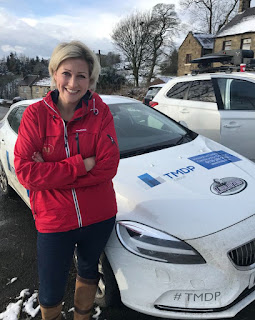 Jack Heald's wife Becky Mantin picture in front of car