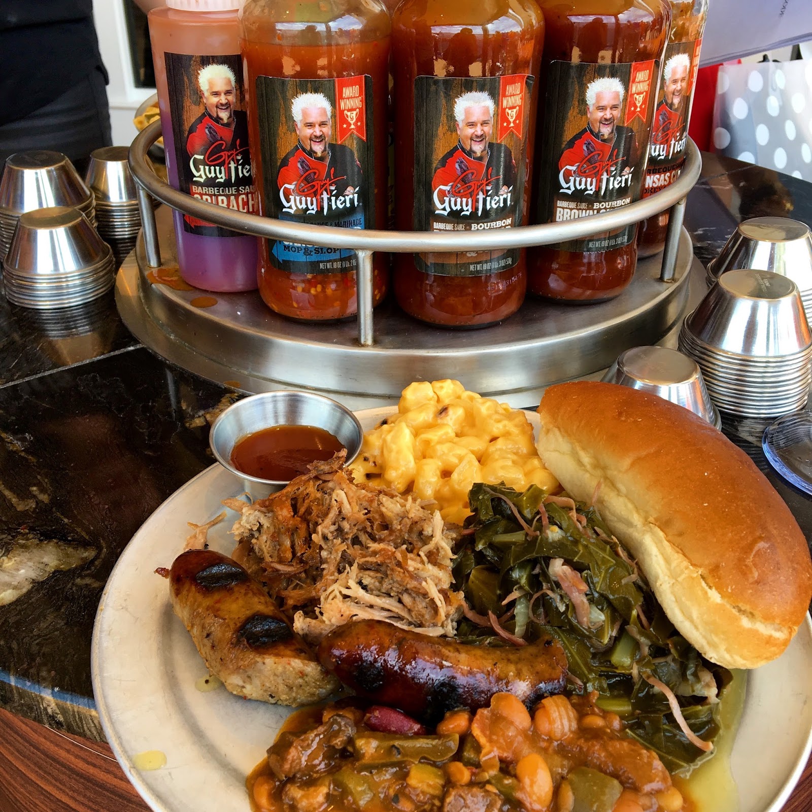 Guy Fieri 's Pig and Anchor BarBQue now on board select Carnival