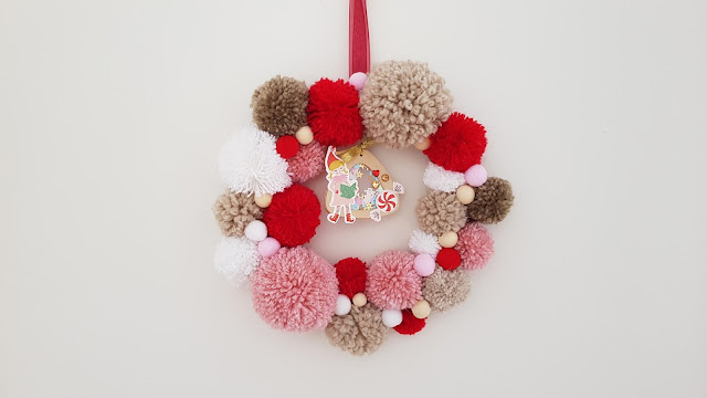 tutorial corona de navidad de pompones