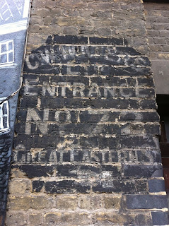 Ghost sign in Garden Walk, Shoreditch, London EC2