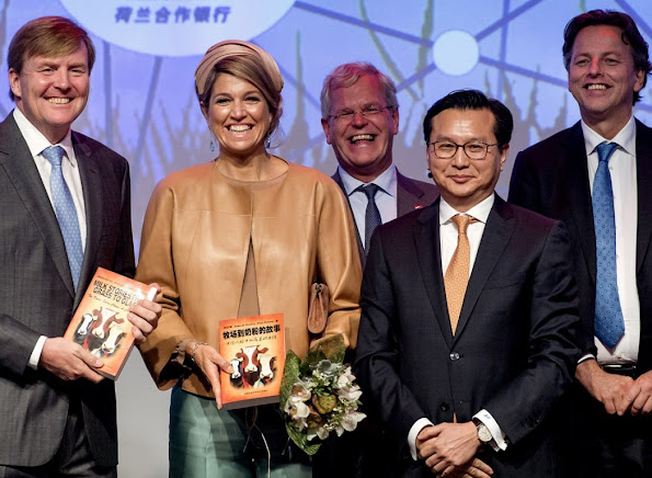 Queen Maxima and King Willem-Alexander of The Netherlands visit the Sino-Dutch Diary Development Center on October 25, 2015 in Beijing, China.