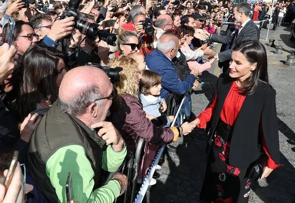 Queen Letizia wore Zara cape style jacket in black and Hugo Boss Banora gathered silk blouse and black floral skirt