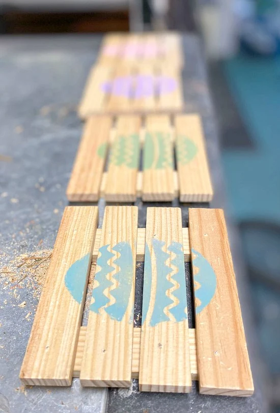Row of pallet coasters with pastel eggs