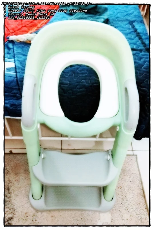 Picture of Aina's potty after it was ready to be installed before being placed on an adult sitting toilet bowl.
