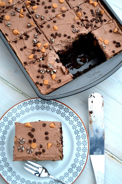 Chocolate sheet cake, poked and filled with butterscotch flavour pudding. Topped with a chocolate cream topping and chocolate chips.