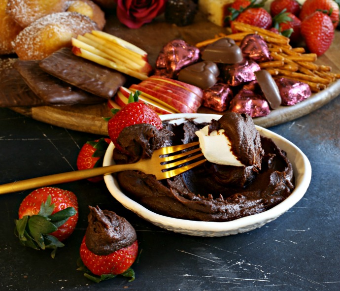 Tips and tricks for building a Valentine's Day dessert treat board including chocolate hummus, fruits and pastries.