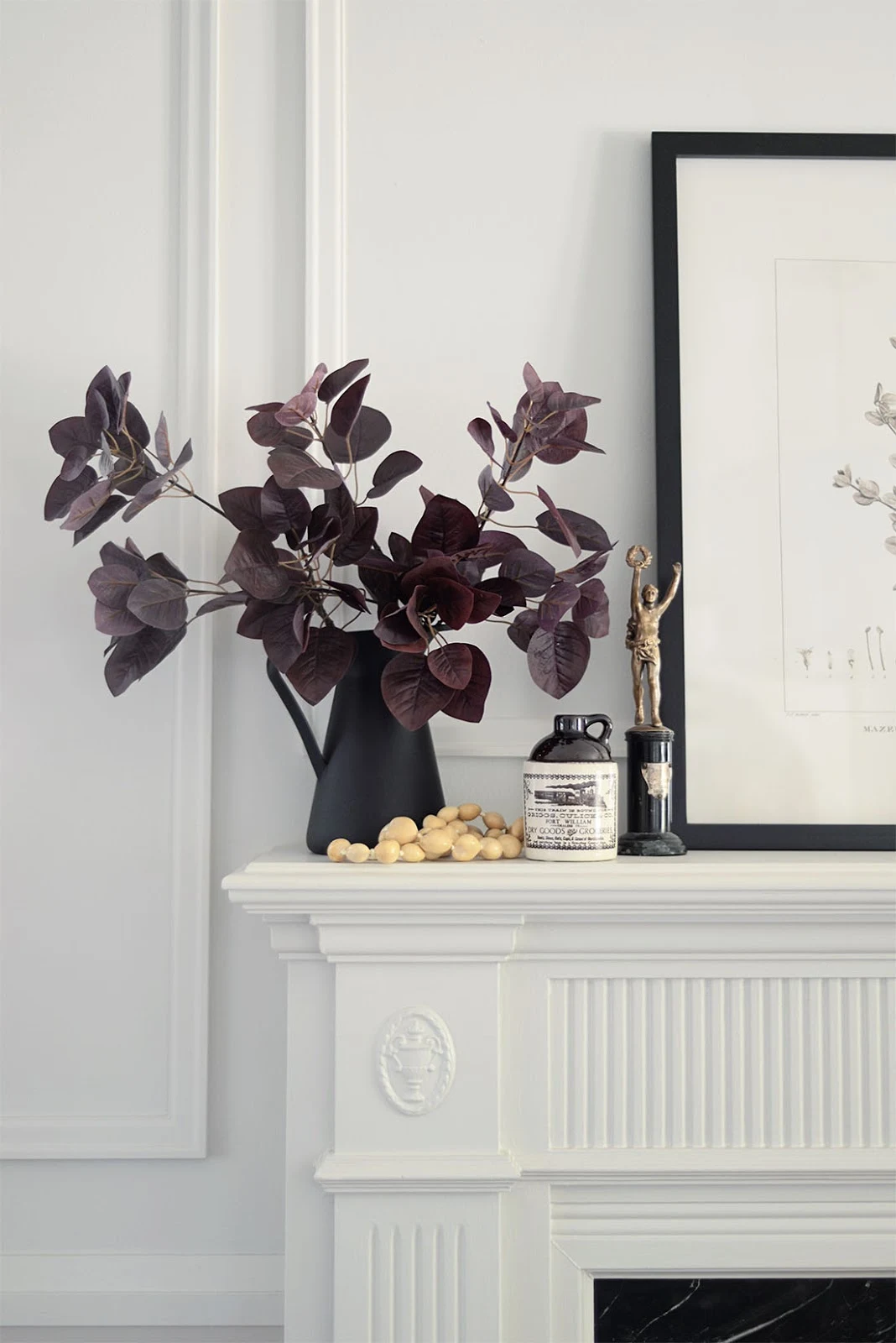 red leaf branch in vase, vintage trophy, art on mantel, mantel decor, fall living room