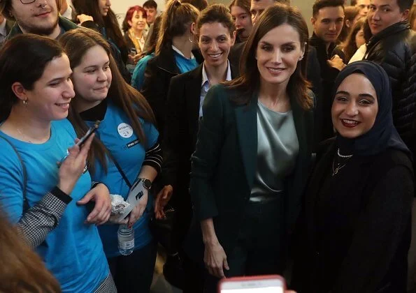 Queen Letizia wore a new suit and a silk blouse by Hugo Boss. Her shoes were by Magrit