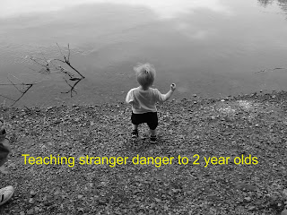 Text: Teaching stranger danger to 2 year olds
Picture: black and white picture of toddler boy throwing rocks into a river