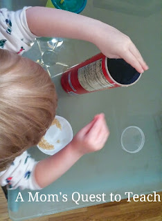 A Mom's Quest to Teach: Crafts: Corn Shaker - Make your own musical instruments! #homeschool #music #kidscrafts #fallcrafts Putting corn kernels into container.