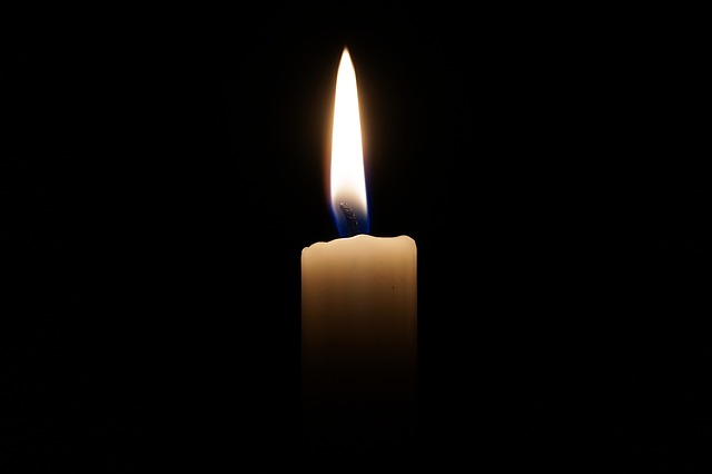 A single candle in the darkness