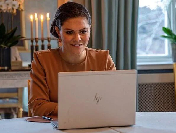 Princess Victoria wore a camel silk blouse from By Malene Birger, By Malina and Filippa K crepe blouse