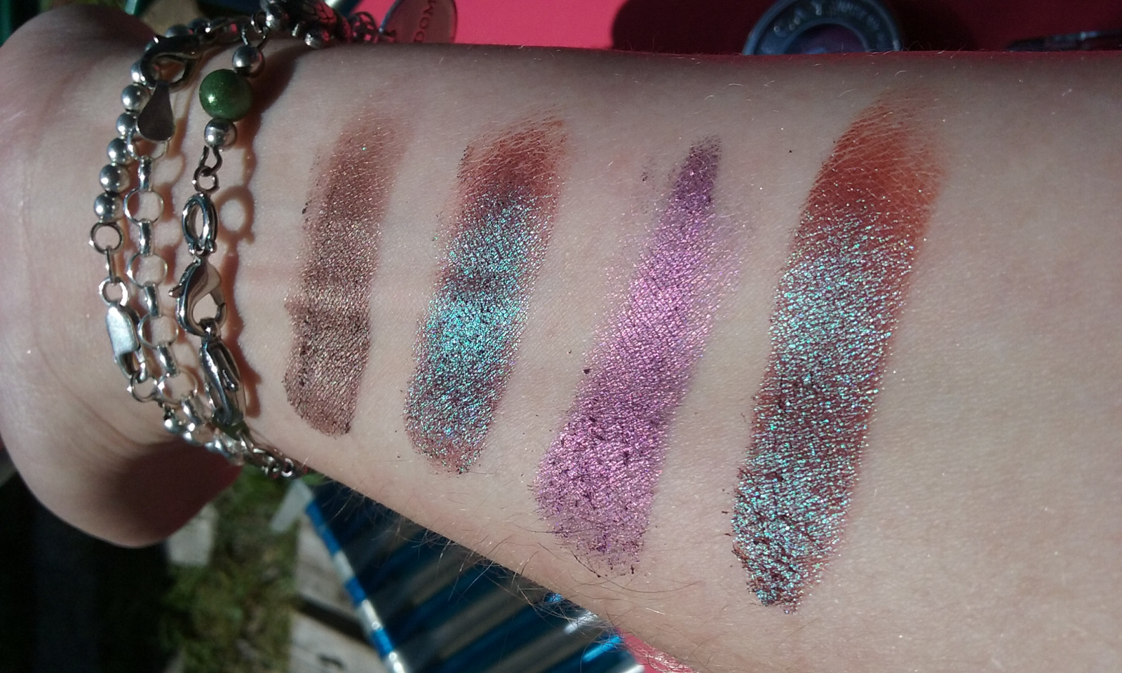 Swatches corresponding to top picture from left to right: Urban Decay Lost Urban...