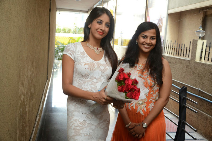 Sanjjanaa in hot white mini skirt dress at sapphire spa launch