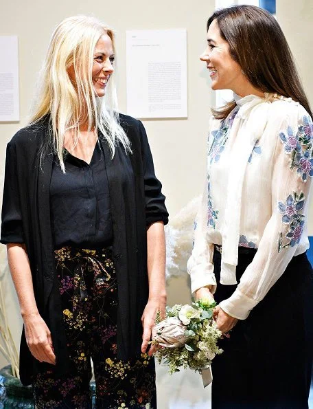 Crown Princess Mary wears Valentino Rockstud patent leather pumps. Photographer Signe Vilstrup portrait exhibition at Yume in Copenhagen