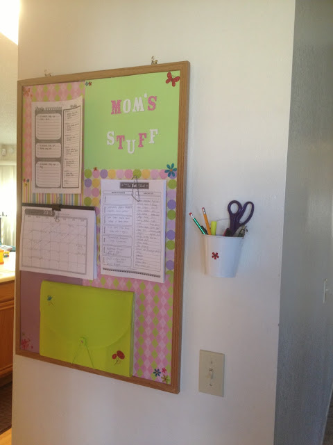 wall with family organizer hanging on it