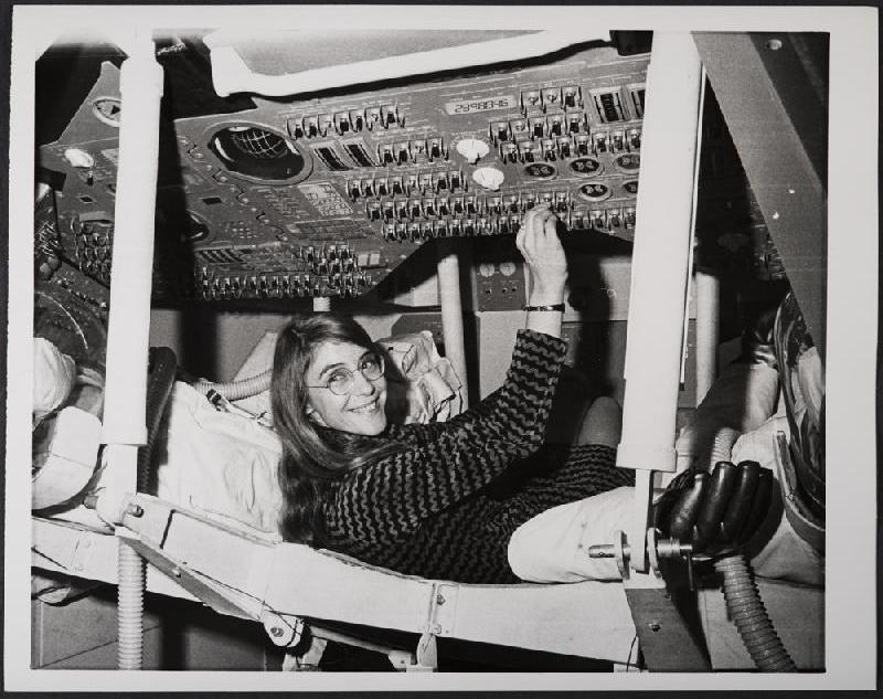 Margaret Hamilton Poses Next to a Huge Stack of Code She Wrote by Hand