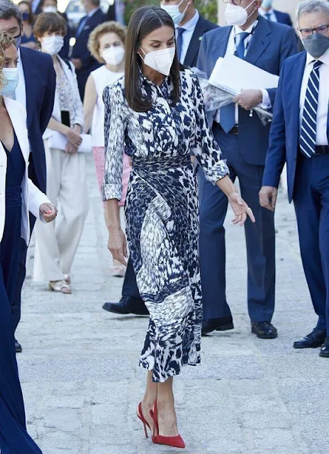 Queen Letizia wore a leopard print silk blouse and midi skirt from Victoria Beckham, and red leathe pumps from Carolina Herrera