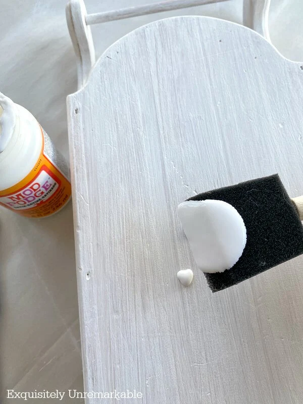 Adding Mod Podge To  Wooden Sled