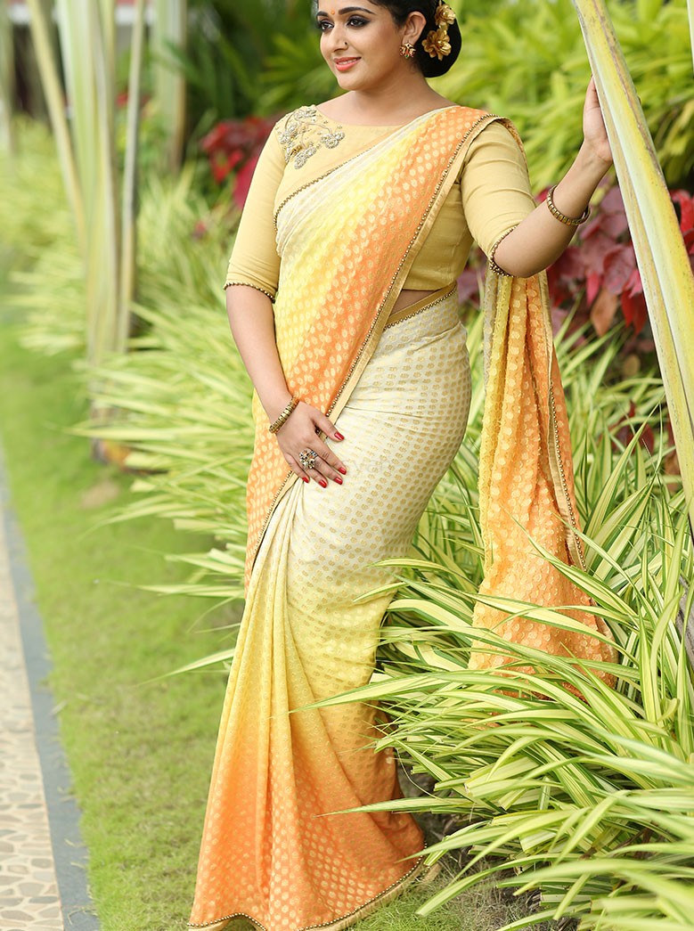 Malayalam actress Kavya Madhavan latest photos in saree for Laksyah. 