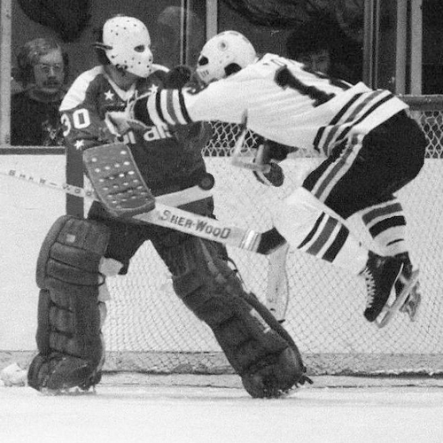 It only looks like... Chicago's Darcy Rota is leaping into Caps goalie Bernie Wolfe while shouting, 'Tag! You're It!'