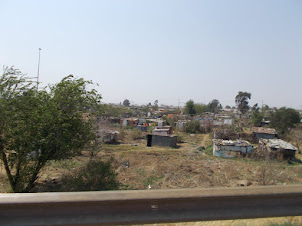 Sharp contrast of wealthy "Gold Reef City" and the slums near Soweto.