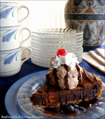 Brownie Butterfingers Pie, a dressed up option to brownie squares. Walnut crust, brownie filling with bits of butterfingers, this pie is perfect for company | Recipe developed by www.BakingInATornado.com | #recipe #chocolate #dessert