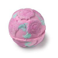 A spherical bright pink bath bomb with swirls engraved into the bath bomb with fflecks of bright pink rose petals encrusted into the bath bomb on a white background