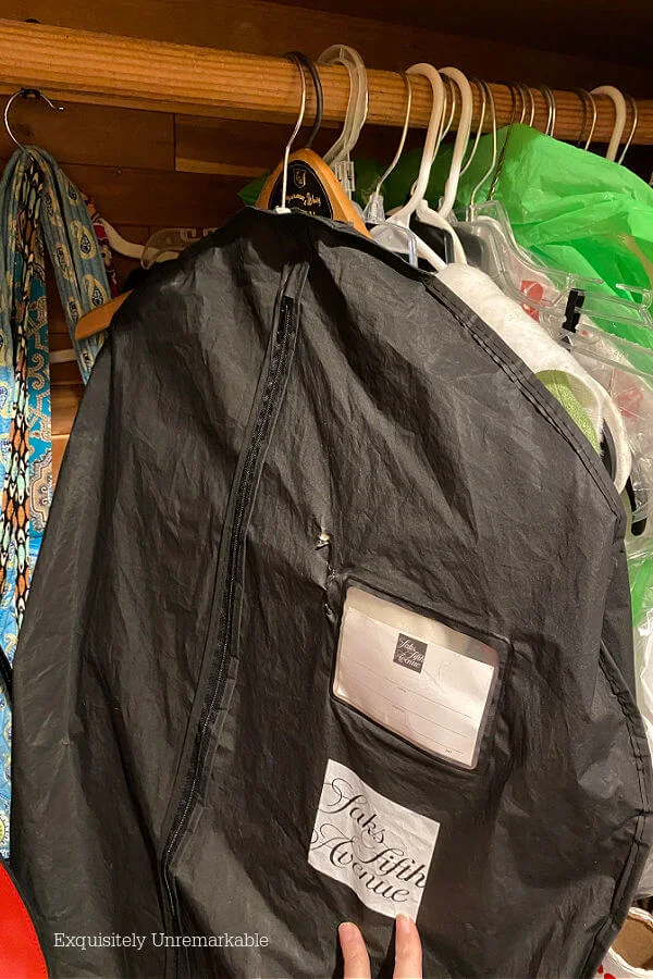 Garment bag hanging in closet