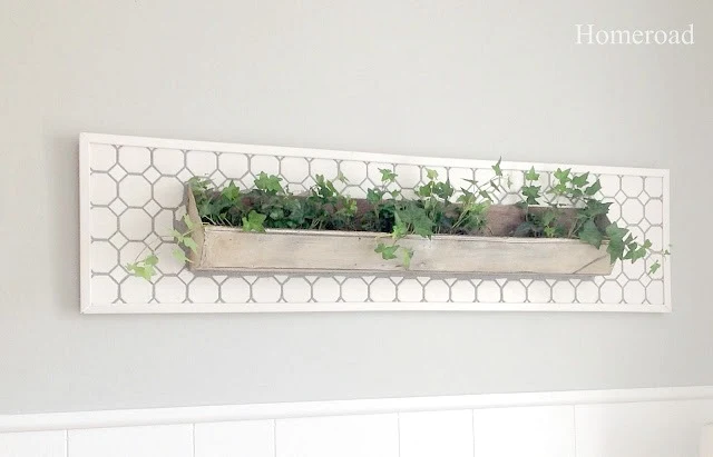 DIY tiled wall garden from a repurposed chicken feeder