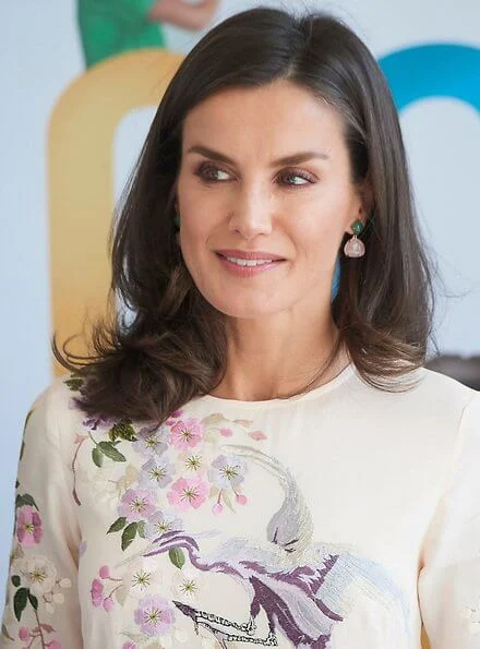 Queen Letizia wore a floral bird embroidery midi dress by Asos Design, and the Queen jewels Coolook Sarin diamond earrings