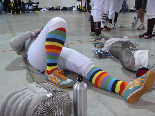 A fencer lays on the floor 