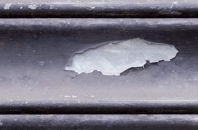 Black painted metal pull down shutter texture at 100% Black painted metal pull down shutter texture at 100%
