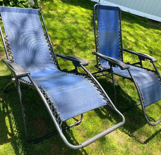 Two blue zero gravity chairs