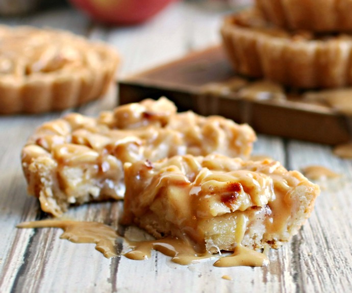 Recipe for individual apple tarts with a peanut crust and peanut butter glaze.