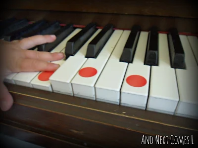 Playing chords on the piano using dot stickers from And Next Comes L