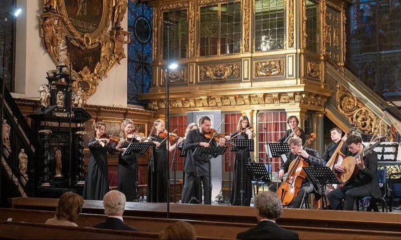 Queen Silvia wore a brown coat and dress from Newhouse Halifax at the Stockholm Early Music Festival 2021