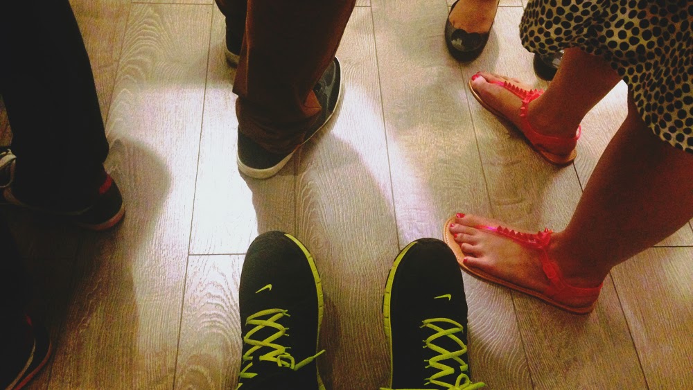 Someone else is wearing sneakers in this shot.