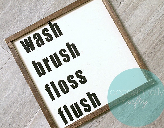 This farmhouse-style wooden sign is perfect for your bathroom and easy to make!