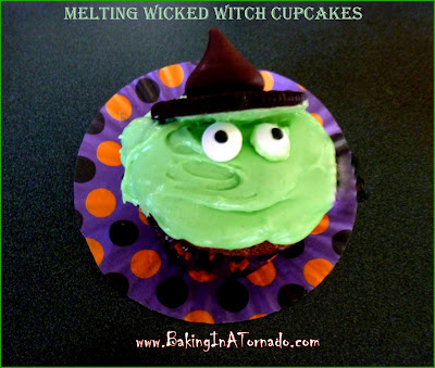 Melting Wicked Witches Cupcakes: rich chocolate syrup cupcake with a sweet melting wicked witch frosting. Garnished with candy eyes and an edible witch's hat | Recipe developed by www.BakingInATornado.com | #recipe #Halloween