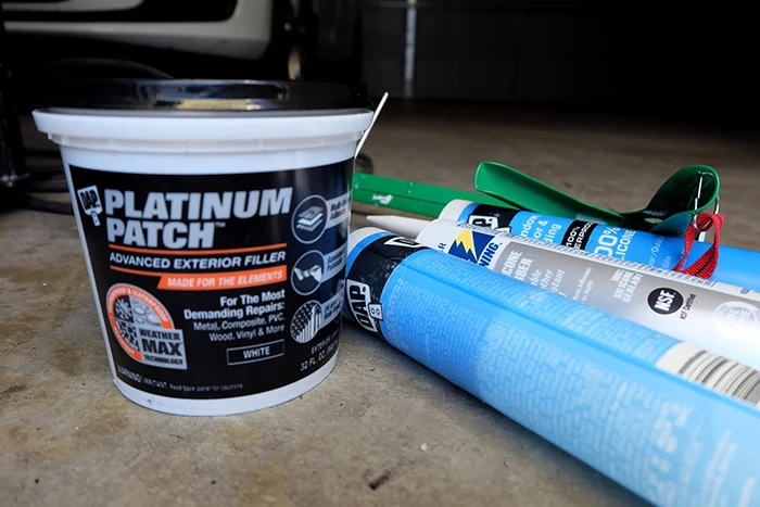 outdoor patch product and tubes of caulk