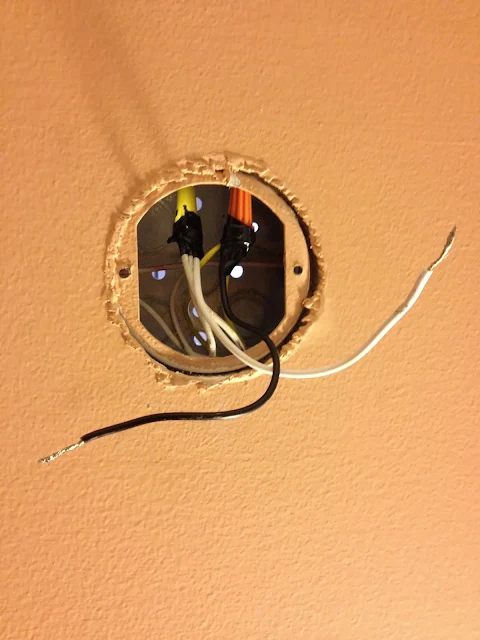 electrical box in bathroom wall