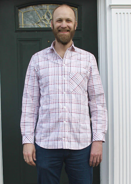 A pink and white plaid men's shirt made using the Thread Theory Fairfield Button-Up Shirt sewing pattern.