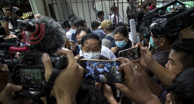 Canadian pastor David Lah speaks to the media outside a township court in Yangon