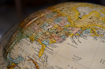 a zoomed image of a globe showing the world map 