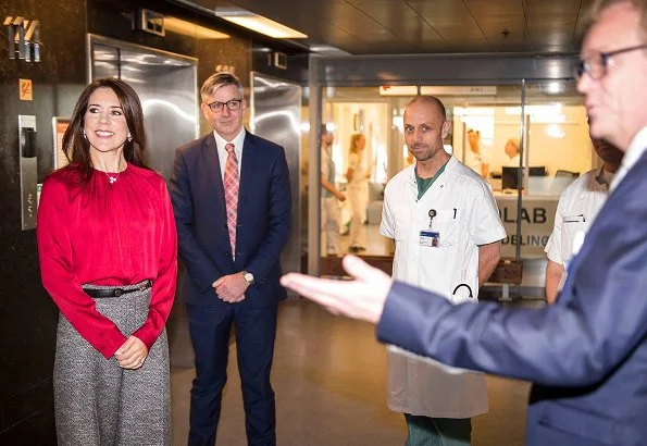 Danish Crown Princess Mary wore Hugo Boss Banora8 blouse and wool trousers at Hotel d'Angleterre in Copenhagen. Danish Heart Association