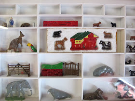 Painted miniature lead toys on display.