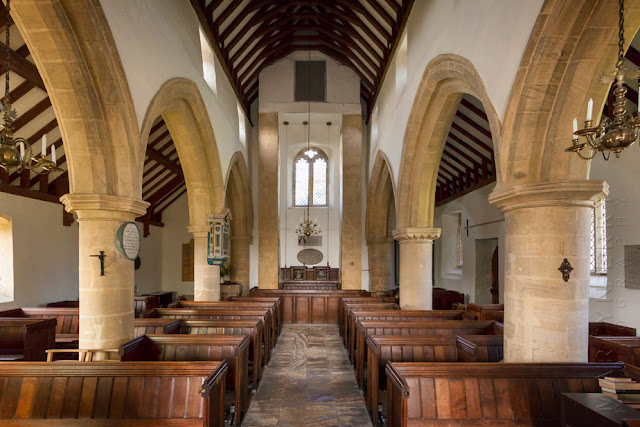 The interior of St Mary's church in the Cotswold village of Swinbrook by Martyn Ferry Photography 