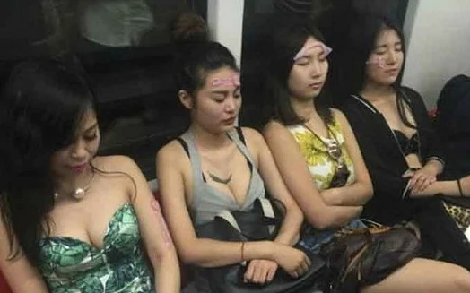 chinese-girls-put-condoms-on-their-face-in-metro