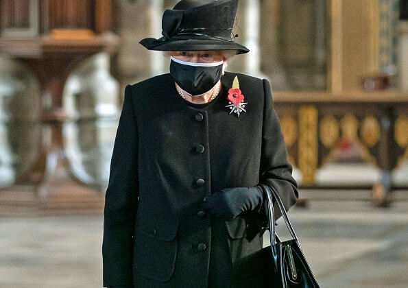 Queen Elizabeth wore a black mask and Jardine diamond star brooch.  National Service of Remembrance at The Cenotaph